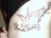 Phoenix rib piece tattoo