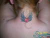 neck heart with wings tattoo