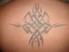 Top centre of back - Needs re-coulour tattoo