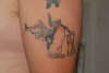 Penguin with a shark on it's arse! tattoo