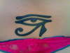 eye of horus on lower back in indigo tattoo