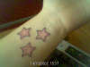 3 pink stars tattoo