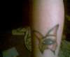 Butterfly with sad eye tattoo