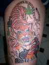 Jap tiger on top leg tattoo