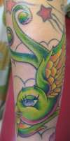 green birdie tattoo