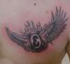 Flamin' eightball flying tattoo