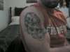 2 skulls with flames tattoo
