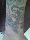 Dragon on wrist tattoo