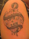 Love Is Pain Healed tattoo