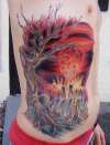 a city getting nuked....and a tree. tattoo