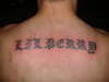 name on back tattoo