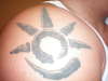 Savage glyphic tattoo