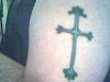 Sinista's Lotus Cross tattoo