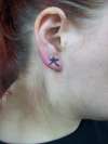 Kanji on ear tattoo