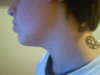 Heartagram neck tattoo