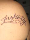 "ZUHEILY" tattoo