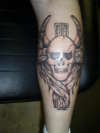 winged skull and cross tattoo