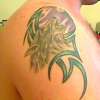Wolf with a Moon & a Tribal tattoo