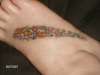 Freehanded stars on foot tattoo