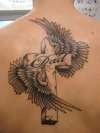 Cross and wings tattoo
