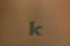 "K" tattoo