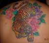 Tiger with flowers tattoo