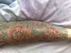 Flowers on right arm sleeve tattoo
