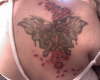 Custom butterfly with flowers tattoo