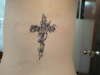 Cross and vines tattoo