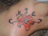 Floral w/ childs name tattoo