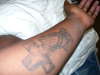 cross and hands tattoo