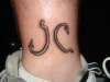 Fish hooks... My initials... JC tattoo