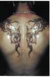 Double Dragon Tribal tattoo