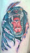 Panther breaking skin tattoo