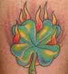 Flaming 4 leaf clover tattoo