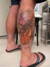 bright  koi on leg tattoo