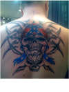 Southern fried skull and gears tattoo