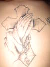 PRayin hands tattoo