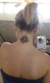 tribal sun and zodiac  sign tattoo