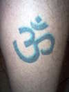 ohm on leg tattoo
