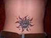 tribal sun tattoo