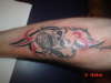 tim tribal w/ skull with red tattoo
