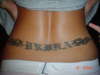 last name of vrbka with tribal on lower back tattoo
