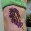 rib piece tattoo