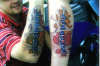 sons name over bricks and streached skin tattoo