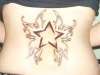 Star with wings tattoo