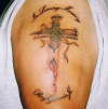 cross through skin tattoo