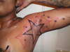 star in arm pit tattoo