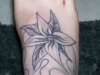 flower on fire tattoo