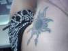 Cover Up Sunburst on back of neck tattoo